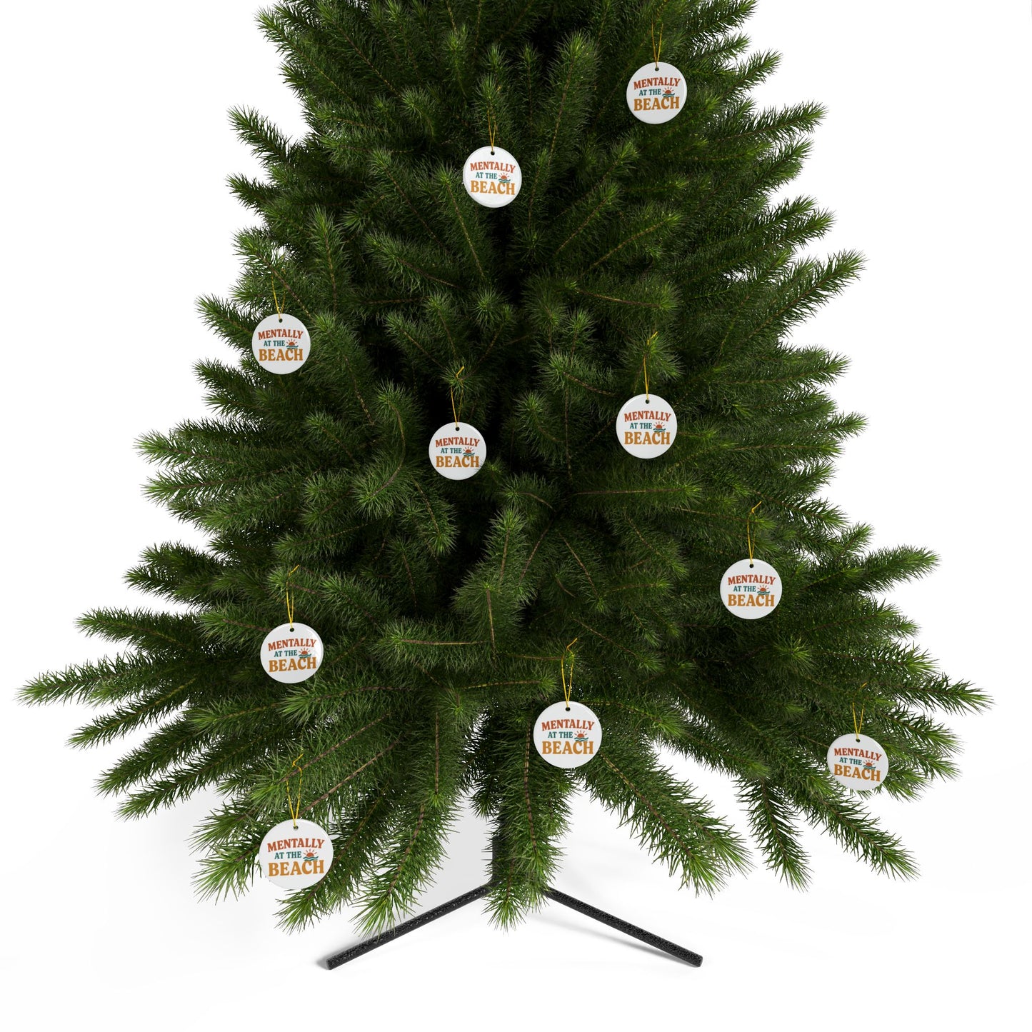 Decorative Christmas tree with 'Mentally at the Beach' ornaments on a white background