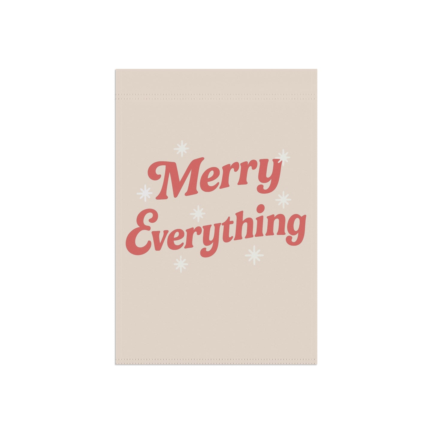 Beige towel with 'Merry Everything' text in red on a white background