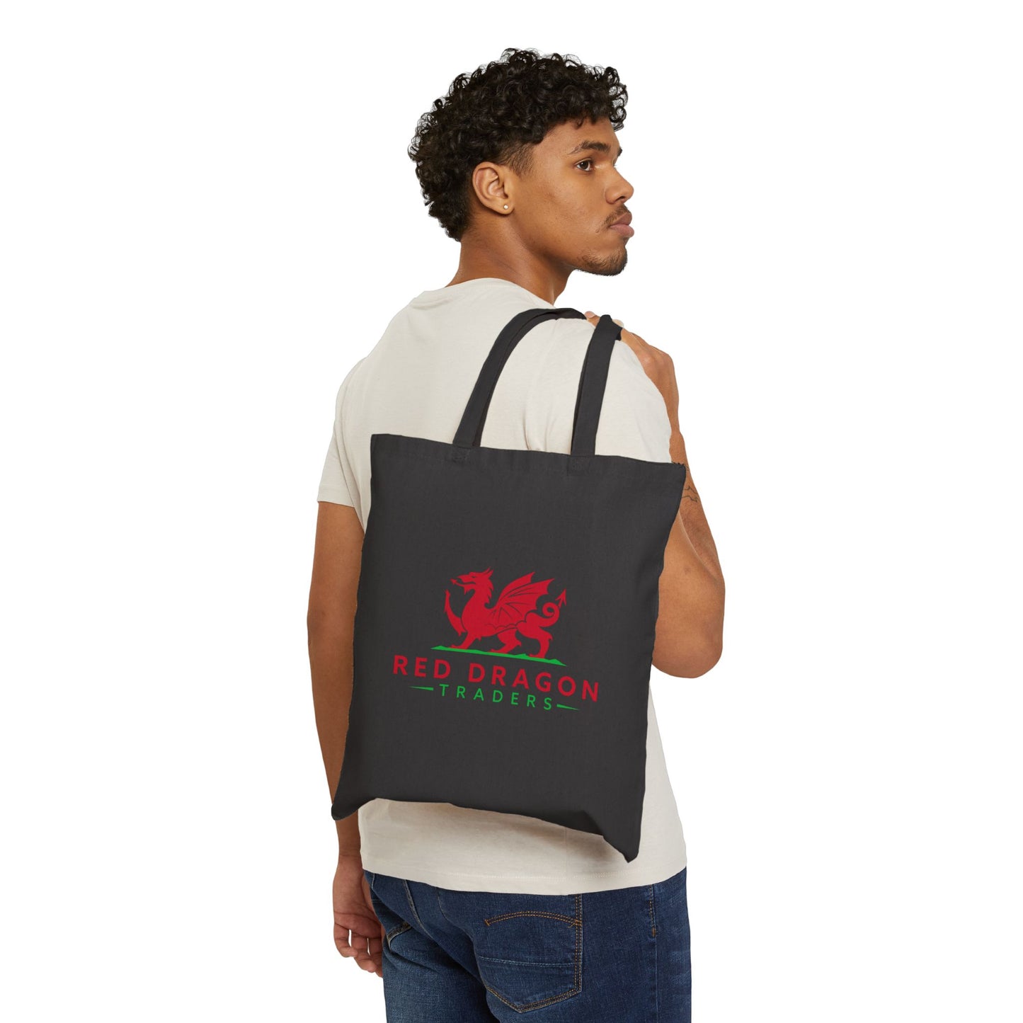 Man carrying a black tote bag with a red dragon logo on a white background