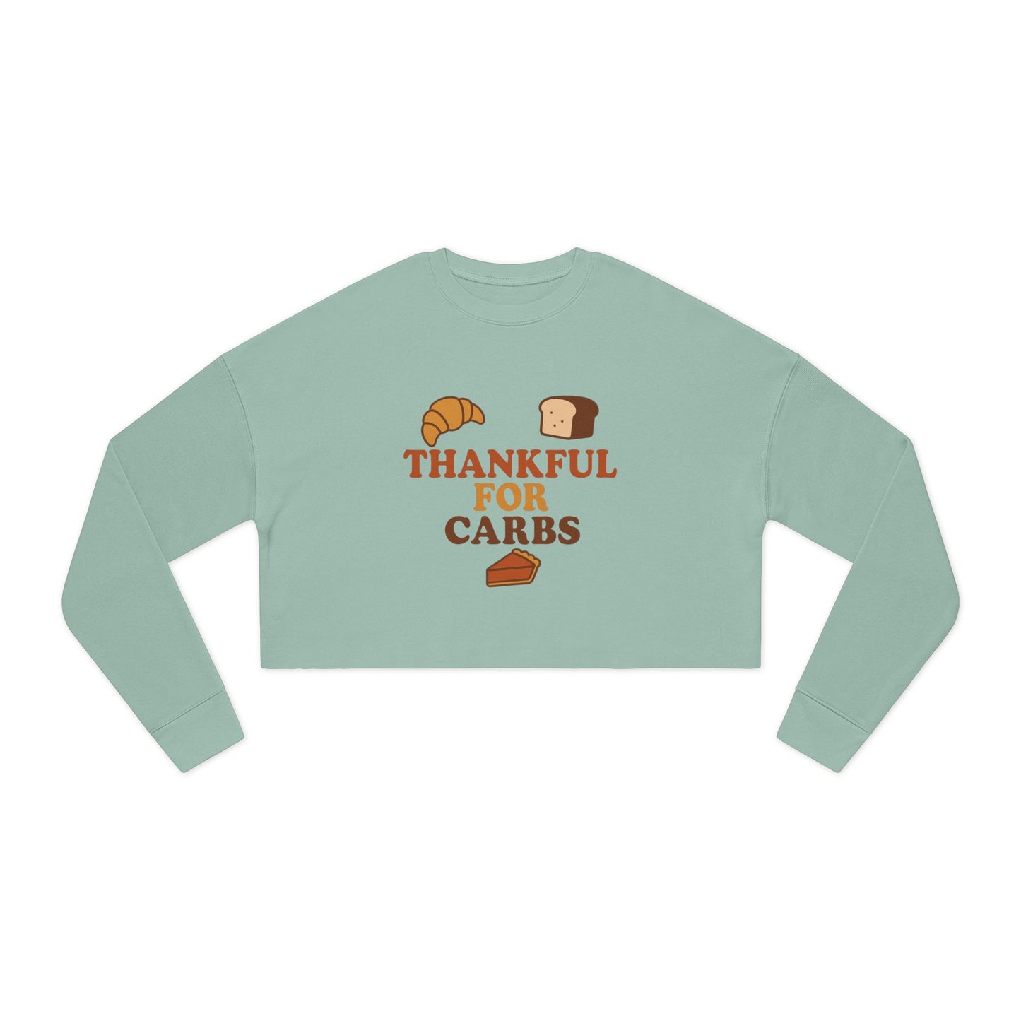 Light green long-sleeve crop top with 'Thankful for Carbs' text and graphics on a white background