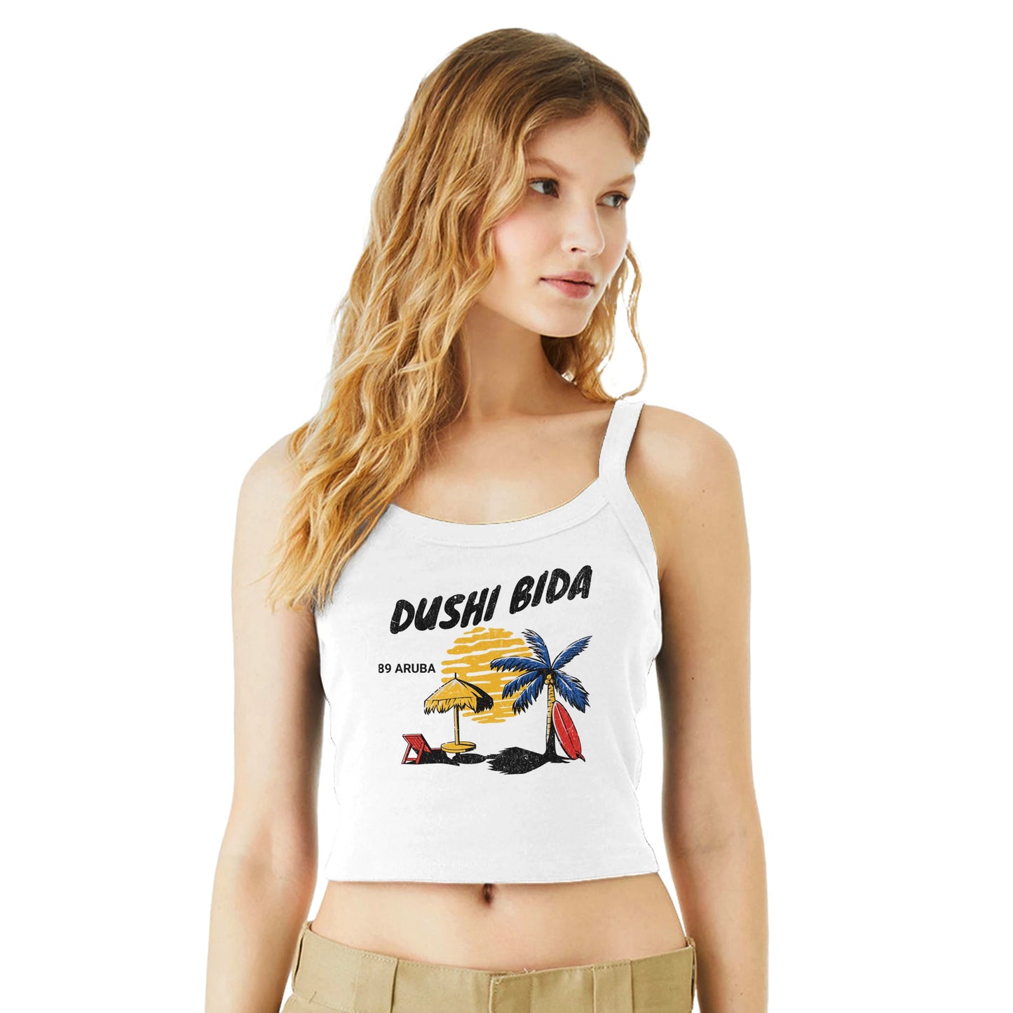White crop top tank with tropical beach scene and the phrase “Dushi Bida” – Caribbean souvenir apparel.