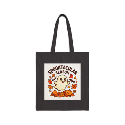 Black tote bag with Halloween-themed design featuring a ghost, pumpkins, and leaves on a white background.