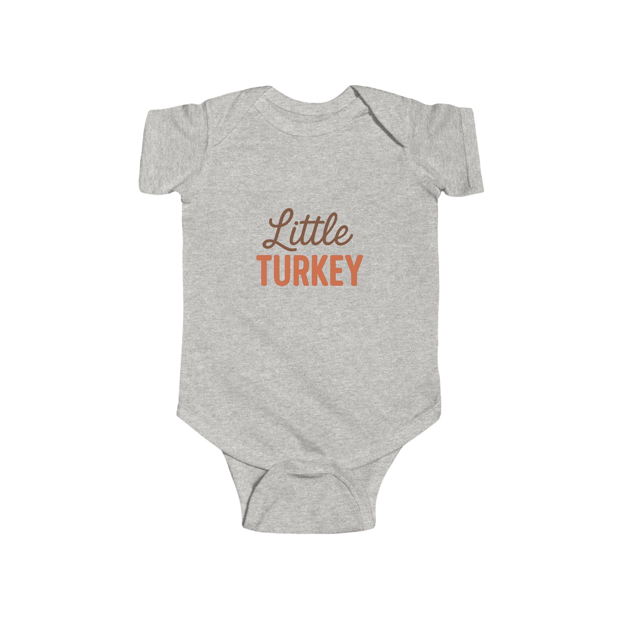 Gray baby onesie with 'Little Turkey' text on a white background
