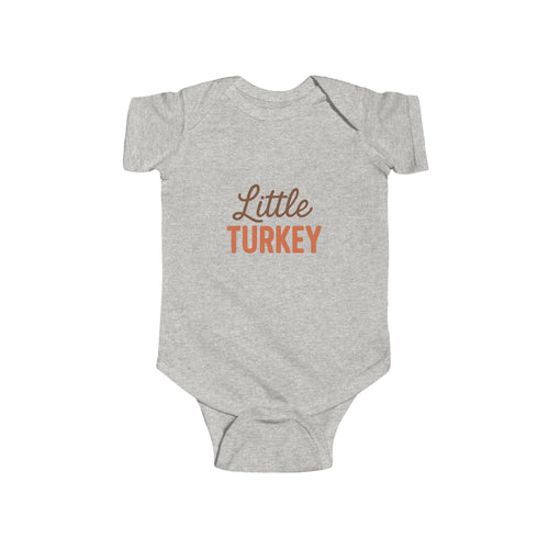 Gray baby onesie with 'Little Turkey' text on a white background