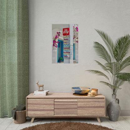 Wooden sideboard with decorative items against a wall with a framed picture and plant.