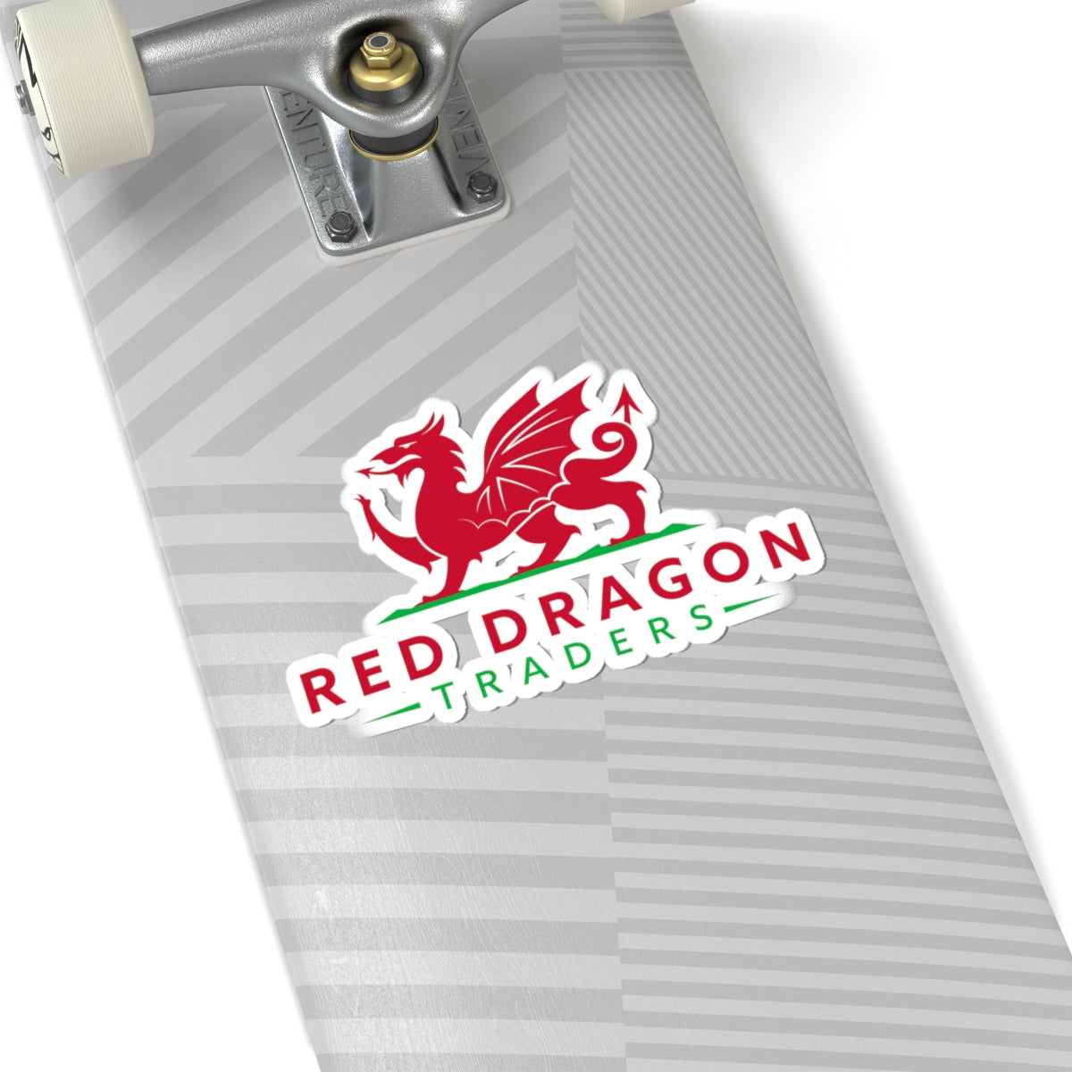 Red Dragon Traders logo sticker on a skateboard.