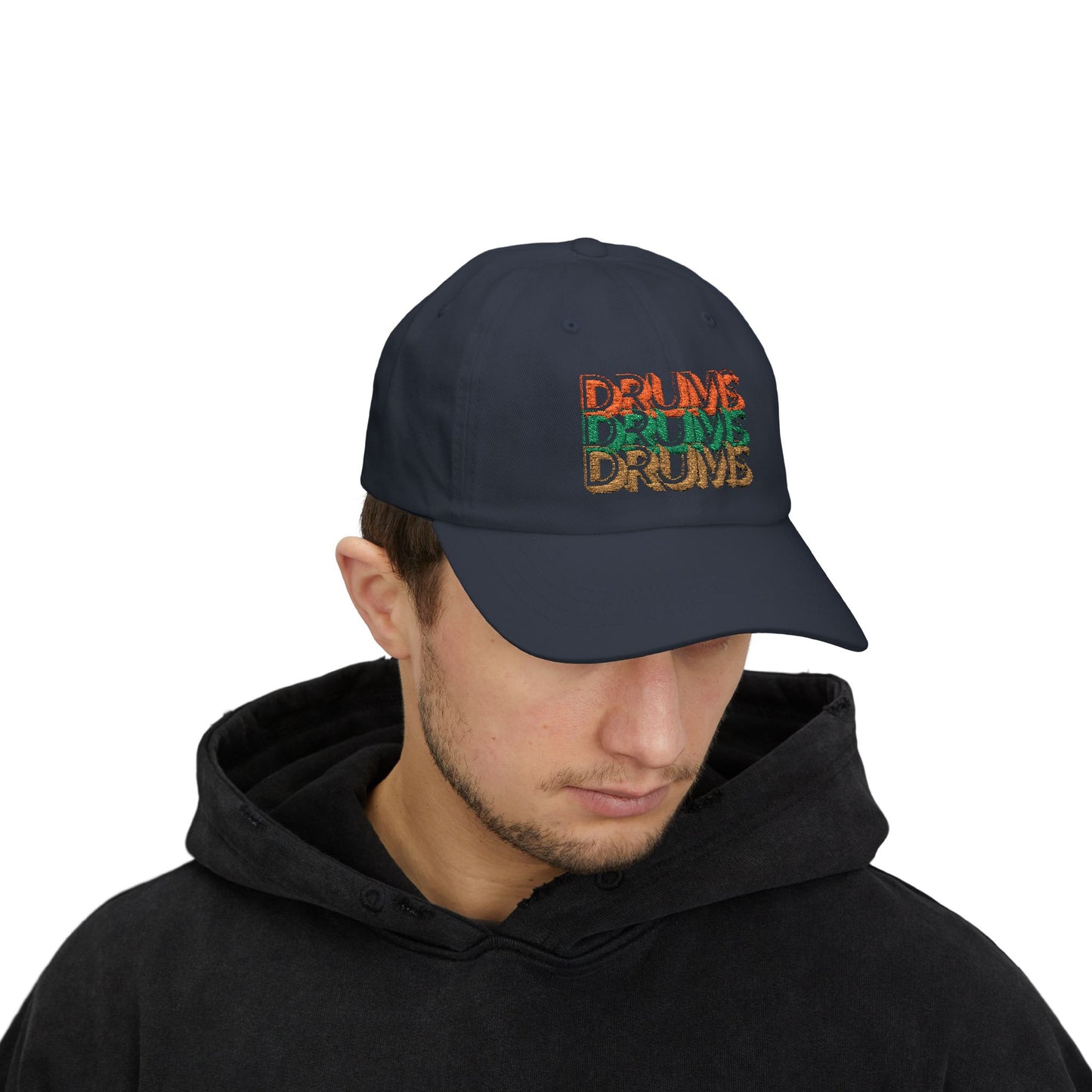 Person wearing a black cap with colorful text on a white background