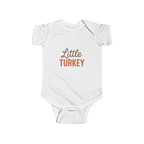 White baby onesie with 'Little Turkey' text on a white background