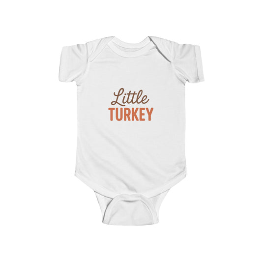 White baby onesie with 'Little Turkey' text on a white background