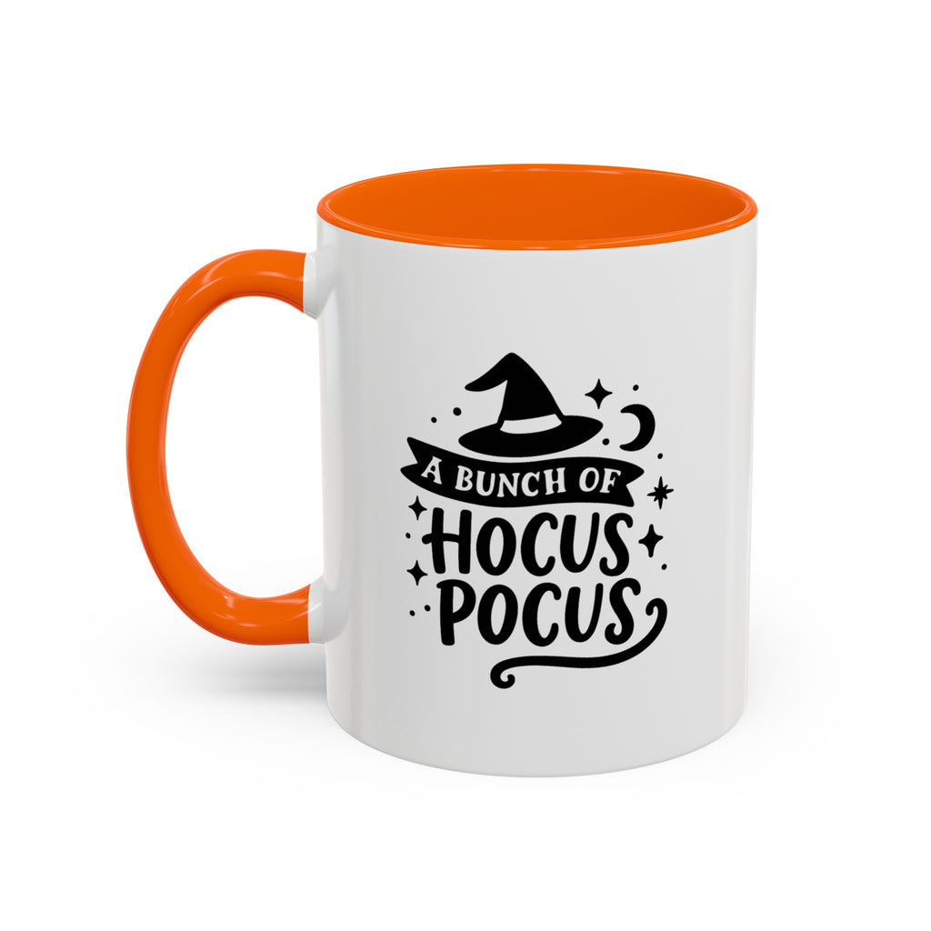 White two-tone coffee mug with a orange handle and interior and a black 'A Bunch of Hocus Pocus' witch-hat design, on a white background