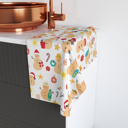 Ceramic sink with a decorative towel featuring Christmas-themed designs on a white background.
