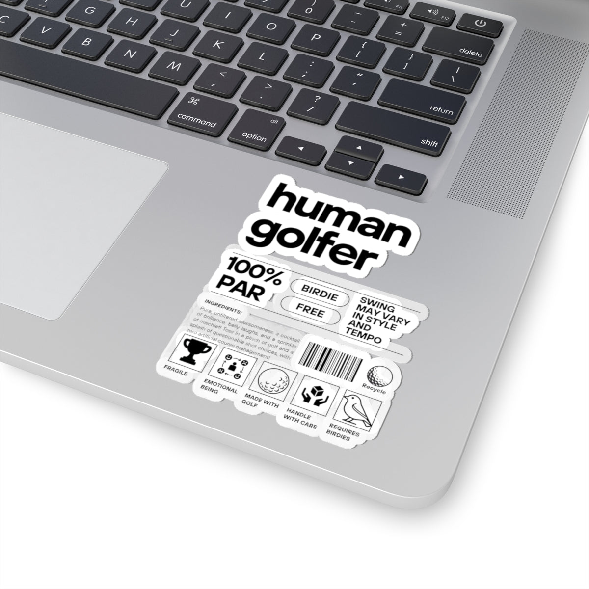 Laptop with a 'human golfer' sticker on the palm rest area