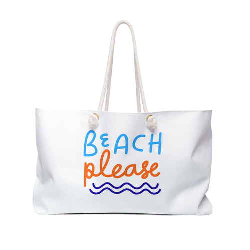 White canvas weekender tote with rope handles and 'Beach Please' text in blue and orange above a wave, on a white background