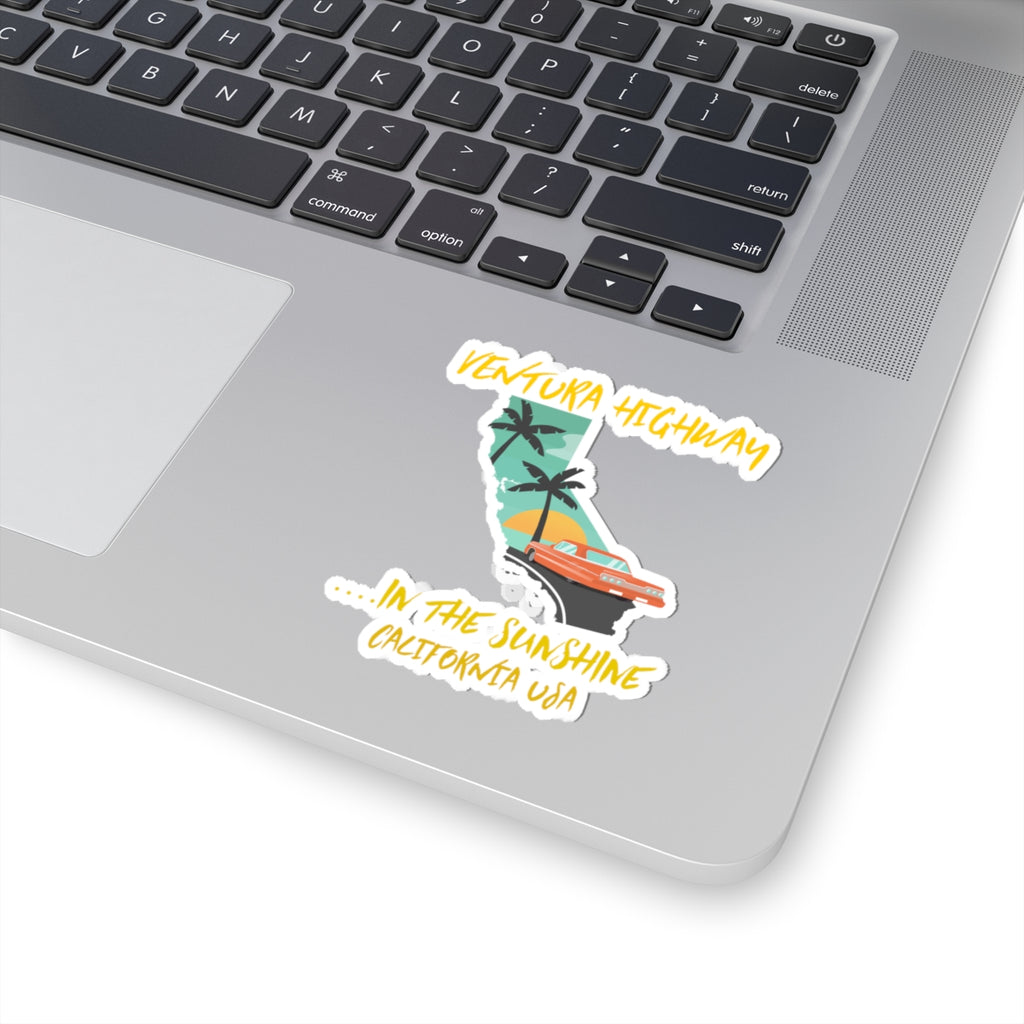 Laptop with a sticker of a stylized map of California and text on the palm tree design.