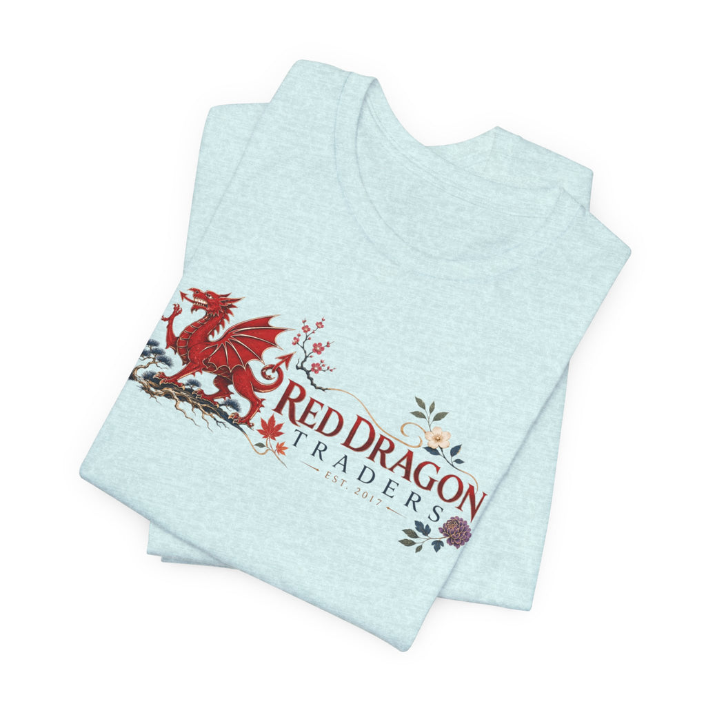 Folded heather ice blue tee showing the floral heraldic dragon up close.