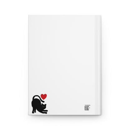 White notepad with a black cat and red heart design on a white background