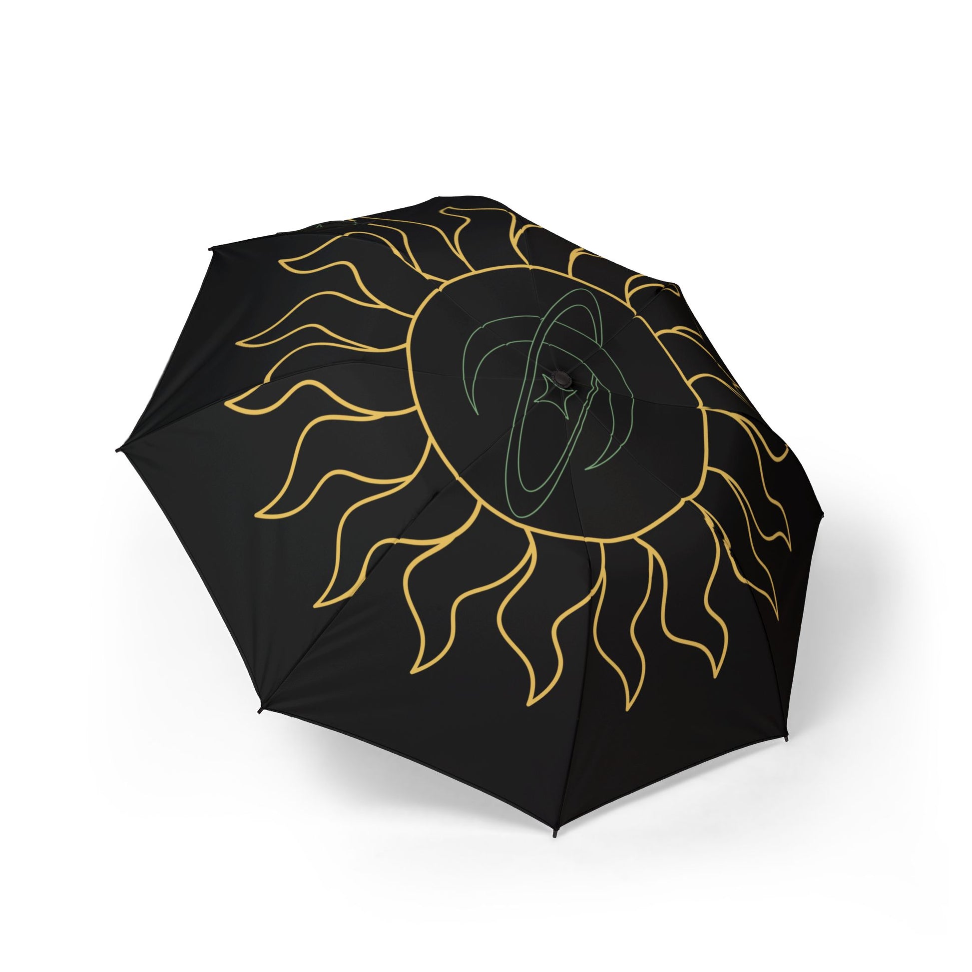 Black umbrella with gold sun design on a white background