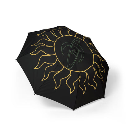 Black umbrella with gold sun design on a white background