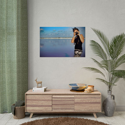 Living room with wooden cabinet, decorative items, and a framed photo on the wall.