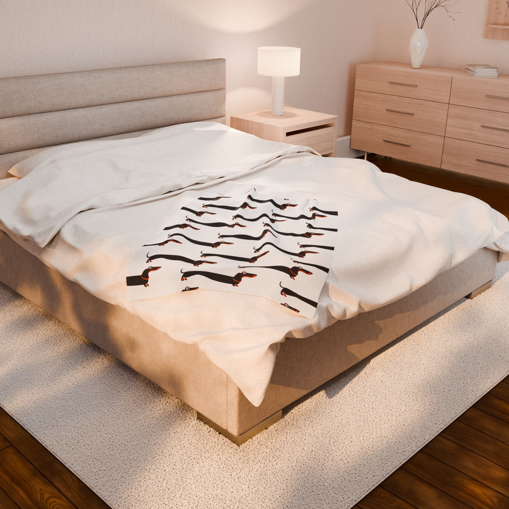 Dachshund blanket on a large bed 