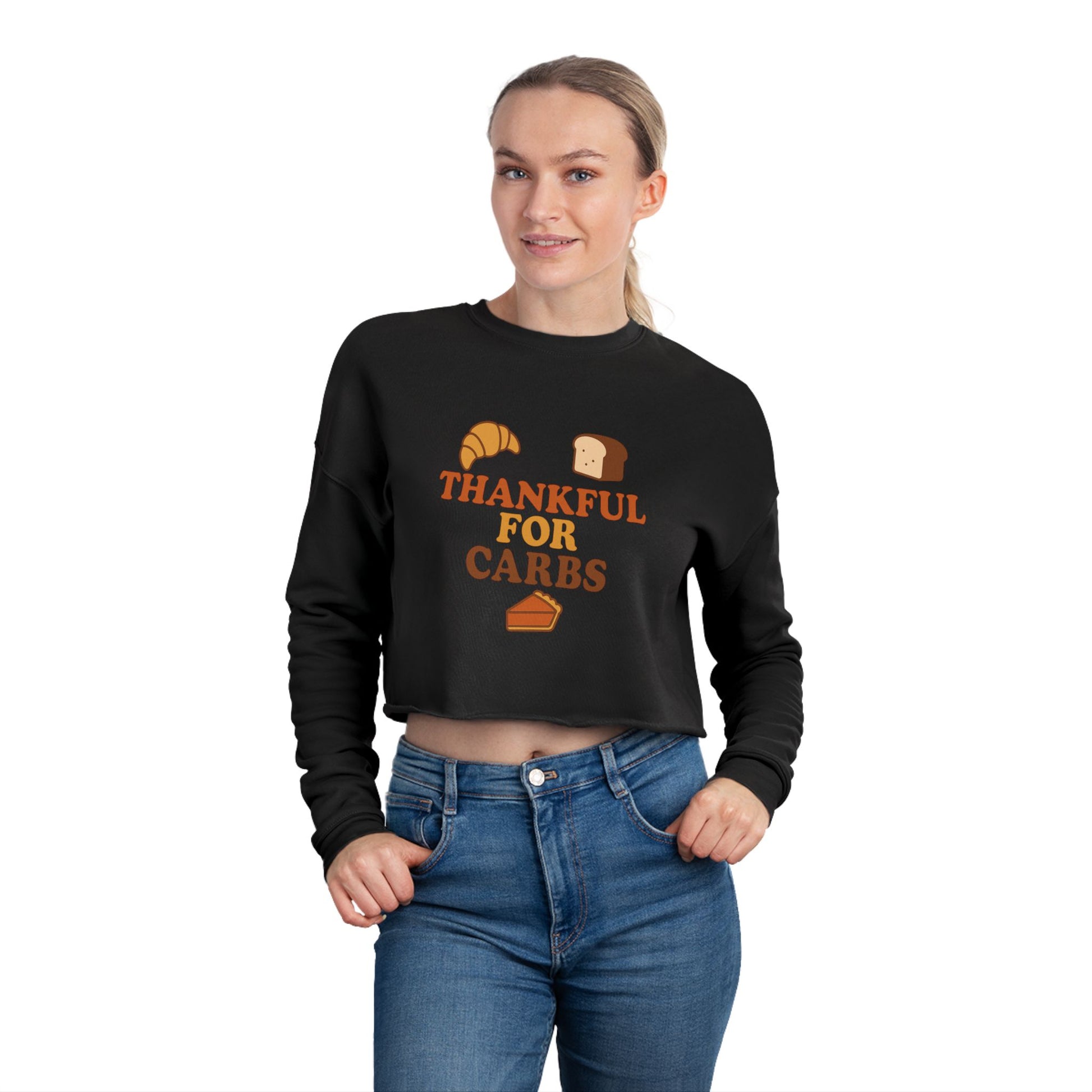 Person wearing a black sweatshirt with 'Thankful for Carbs' text and food graphics on a white background
