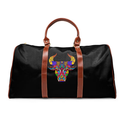 Black duffel bag with colorful bull design and brown straps on a white background