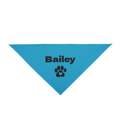 Blue triangular dog bandana with 'Bailey' and a paw print on a white background