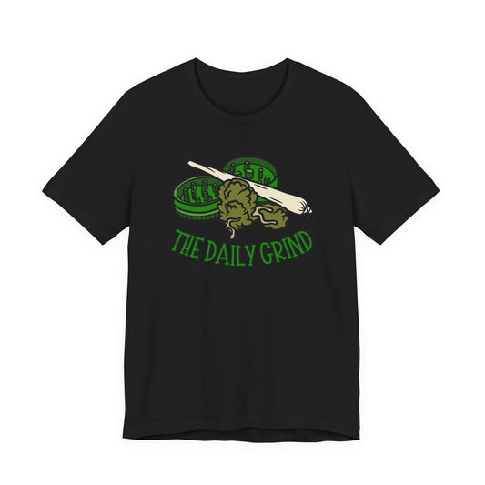Black t-shirt with green graphic and 'The Daily Grind' text on a white background
