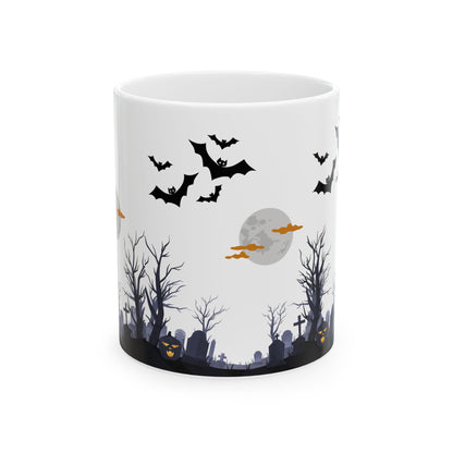 White mug with Halloween-themed design featuring bats, a moon, and trees on a white background
