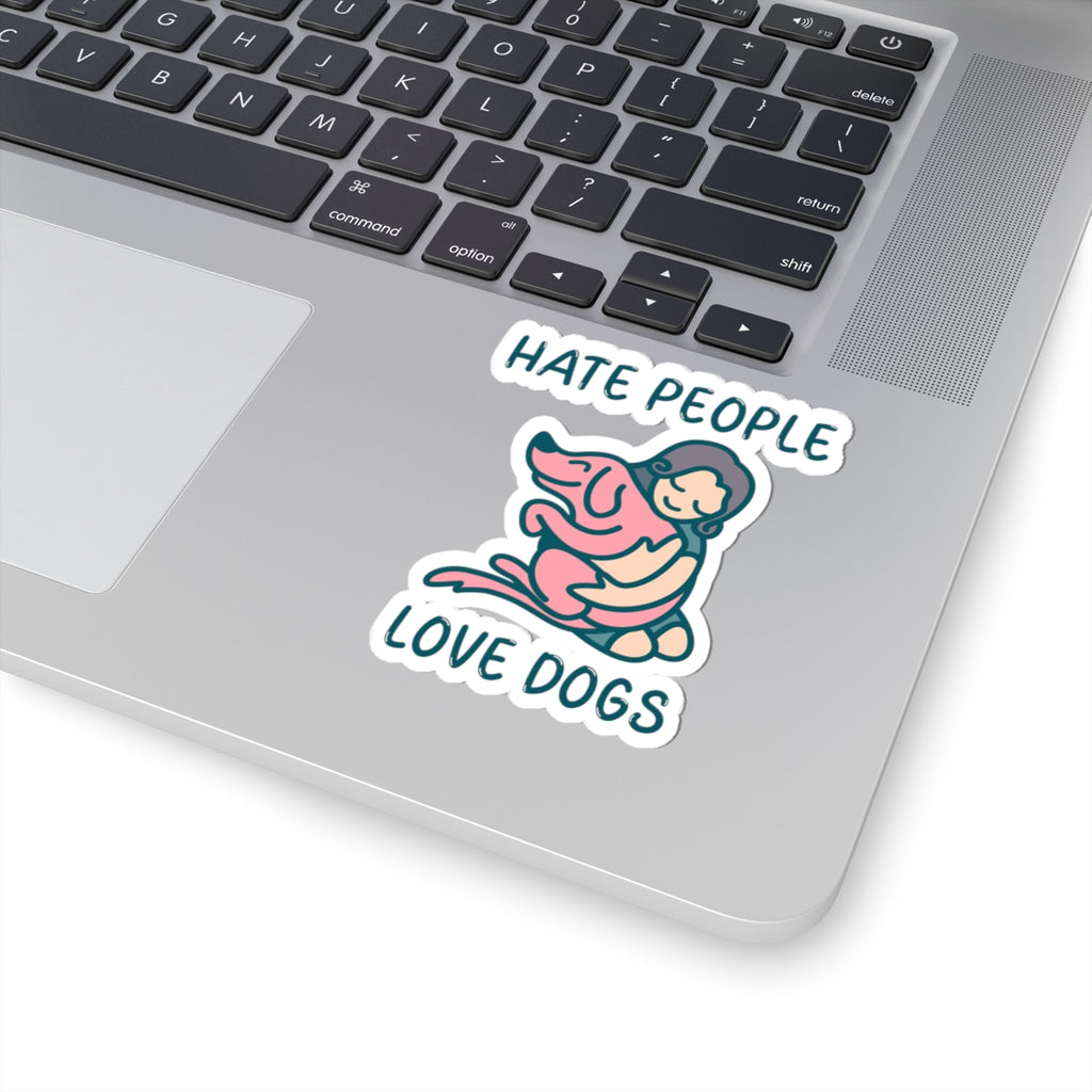 Laptop with a sticker that says 'Hate people love dogs' on the palm rest area.