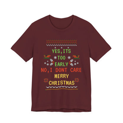 Maroon t-shirt with Christmas-themed text and graphics on a white background