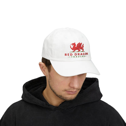 Person wearing a white cap with a red dragon logo and 'Red Dragon Traders' text on a white background