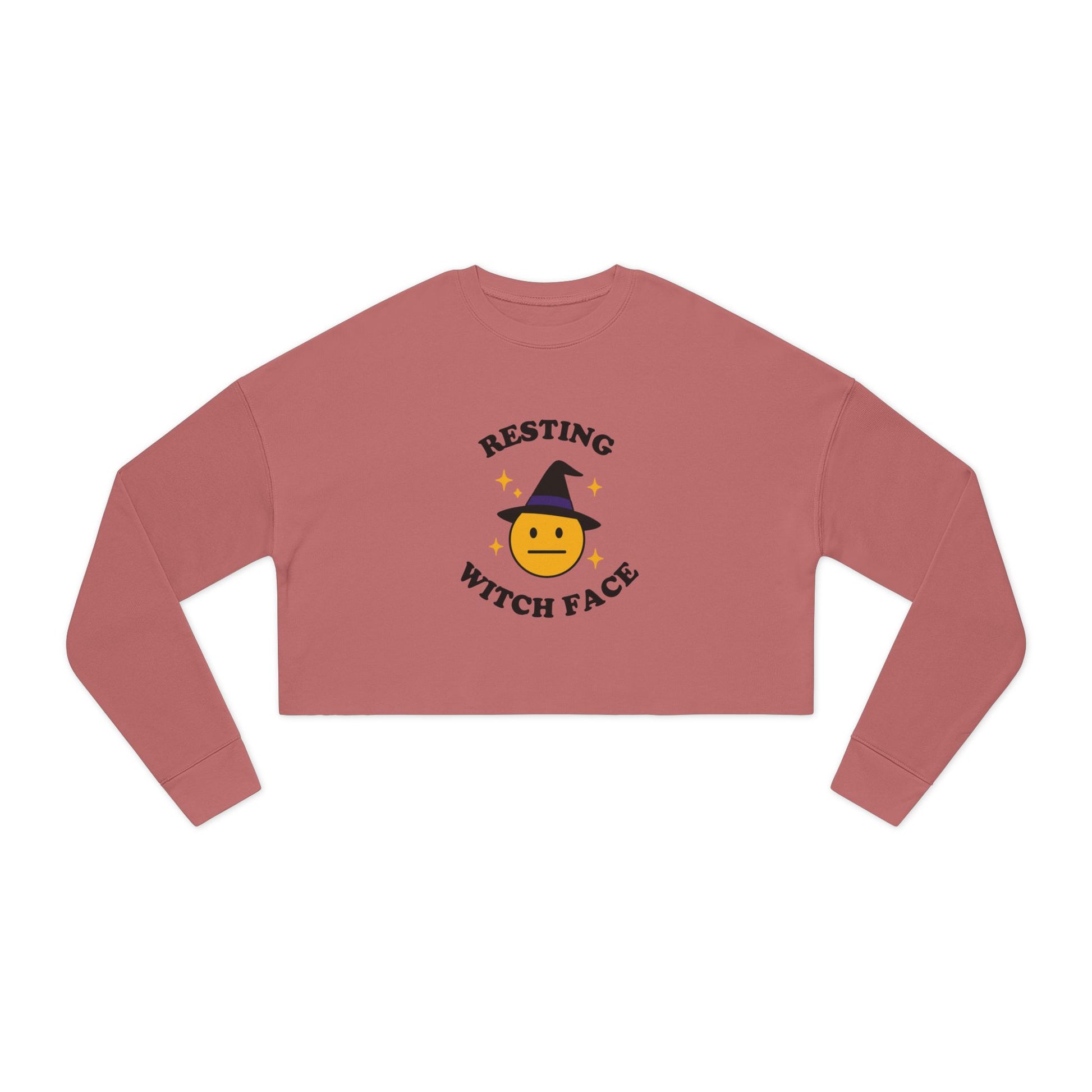 Pink long-sleeve crop top with 'Resting Witch Face' design on a white background