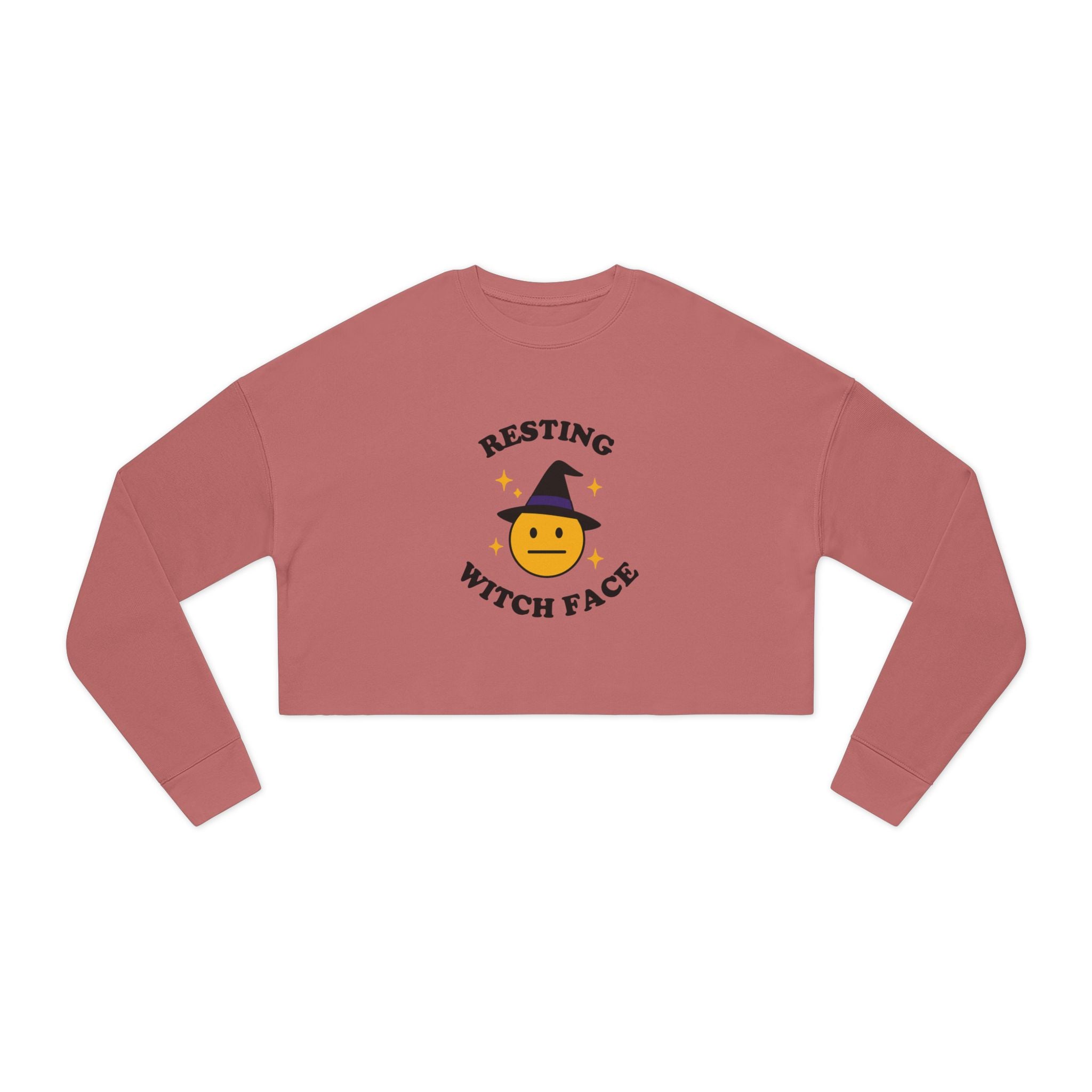 Pink long-sleeve crop top with 'Resting Witch Face' design on a white background