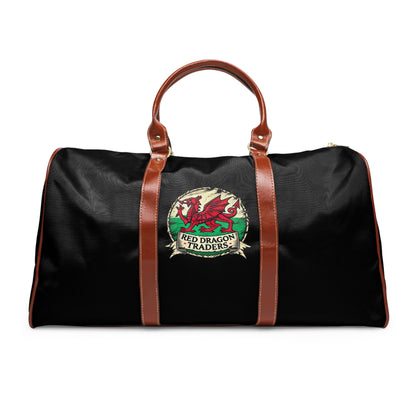 Black duffel bag with brown straps and Red Dragon Traders logo on a white background