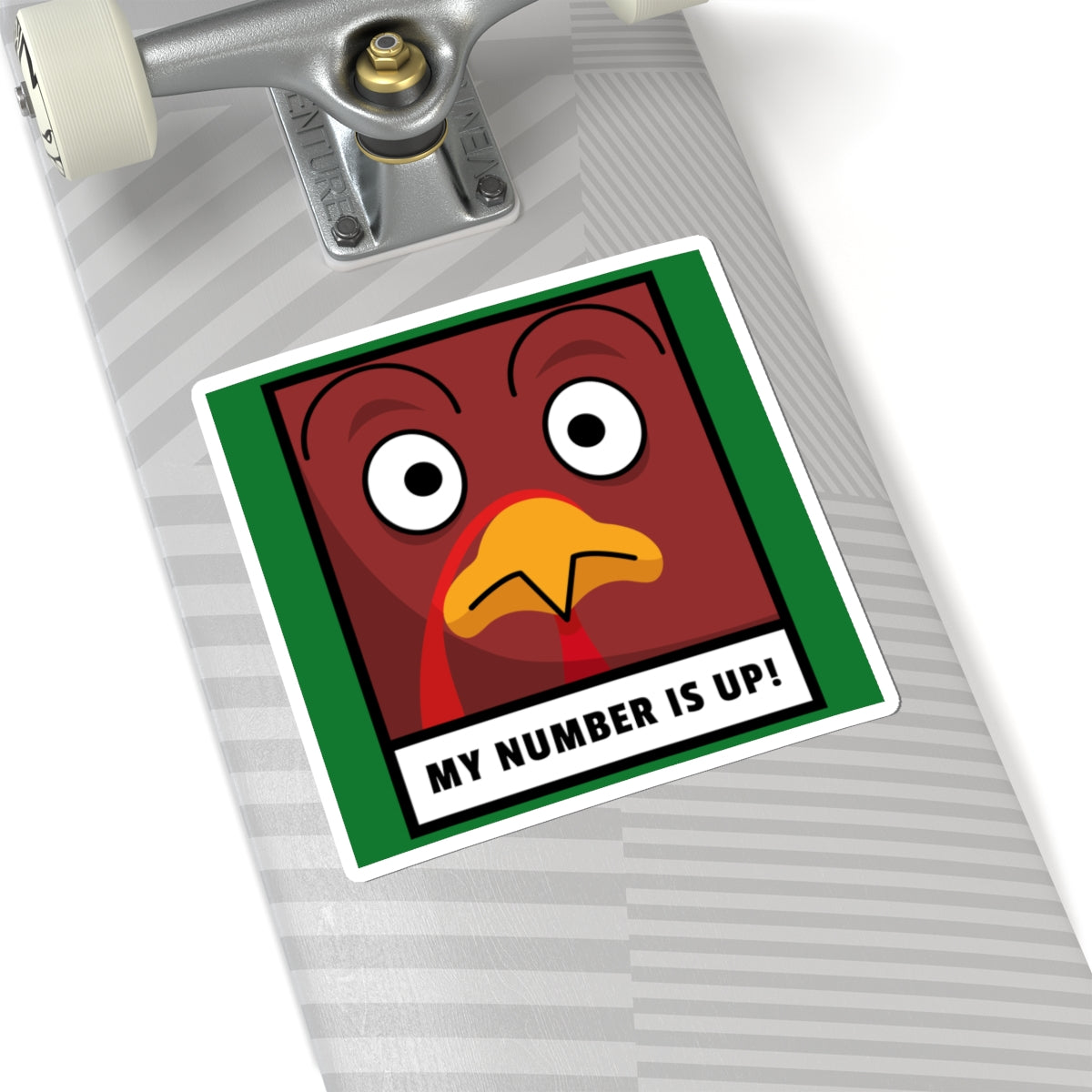 Sticker with a cartoon turkey face and text 'My number is up!' on a skateboard deck.