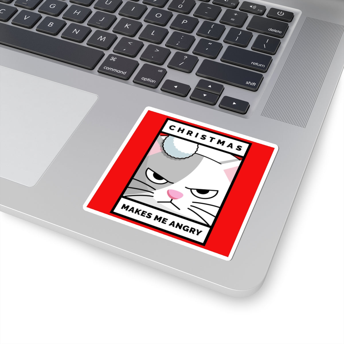 Laptop with a Christmas-themed sticker on the palm rest area