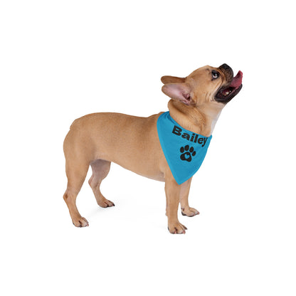 Dog wearing a blue bandana with 'Bailey' and a paw print on a white background
