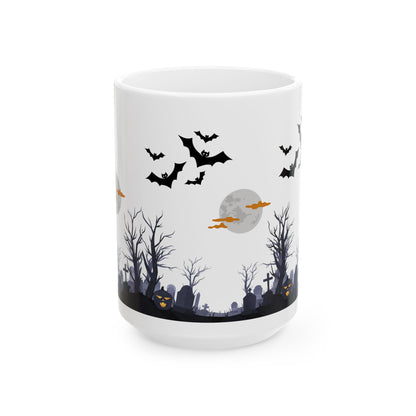 White mug with Halloween-themed design featuring bats, graves, and a moon on a white background