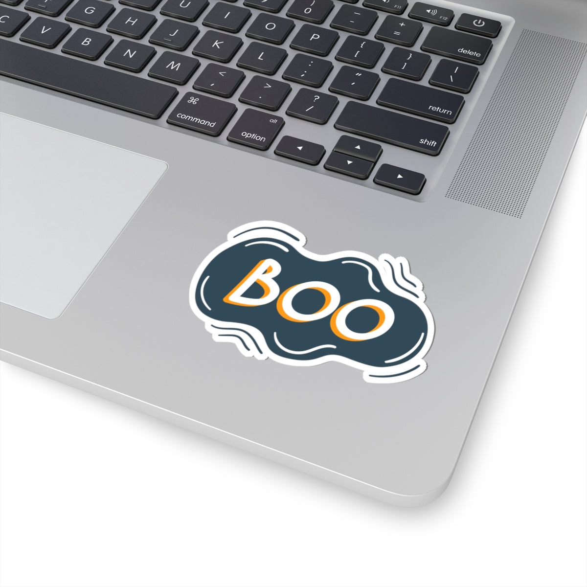 Laptop with a 'BOO' sticker on the palm rest area
