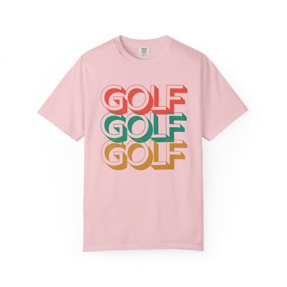 Pink t-shirt with 'GOLF GOLF GOLF' text in different colors on a white background