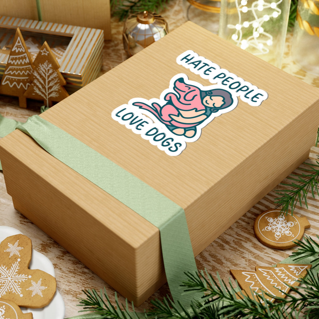 Wooden gift box with a decorative ribbon and a sticker reading 'Hate people, love dogs' on a festive background.