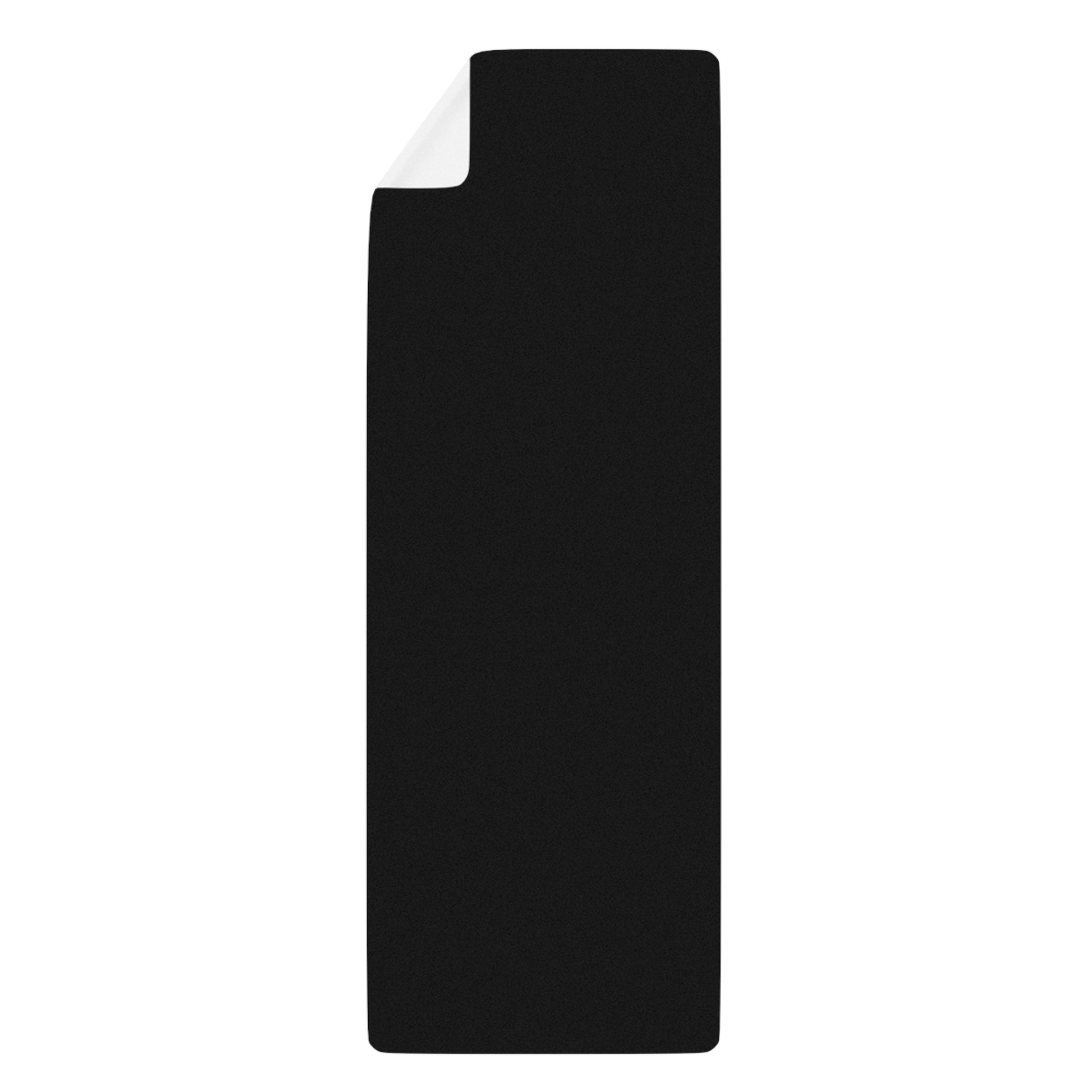 Black back of yoga mat with a white interior on a white background