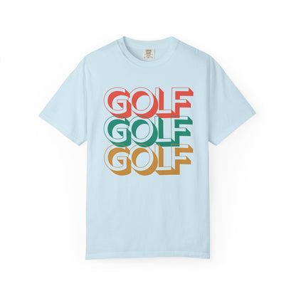 Light blue t-shirt with 'GOLF GOLF GOLF' text in red, green, and orange on a white background