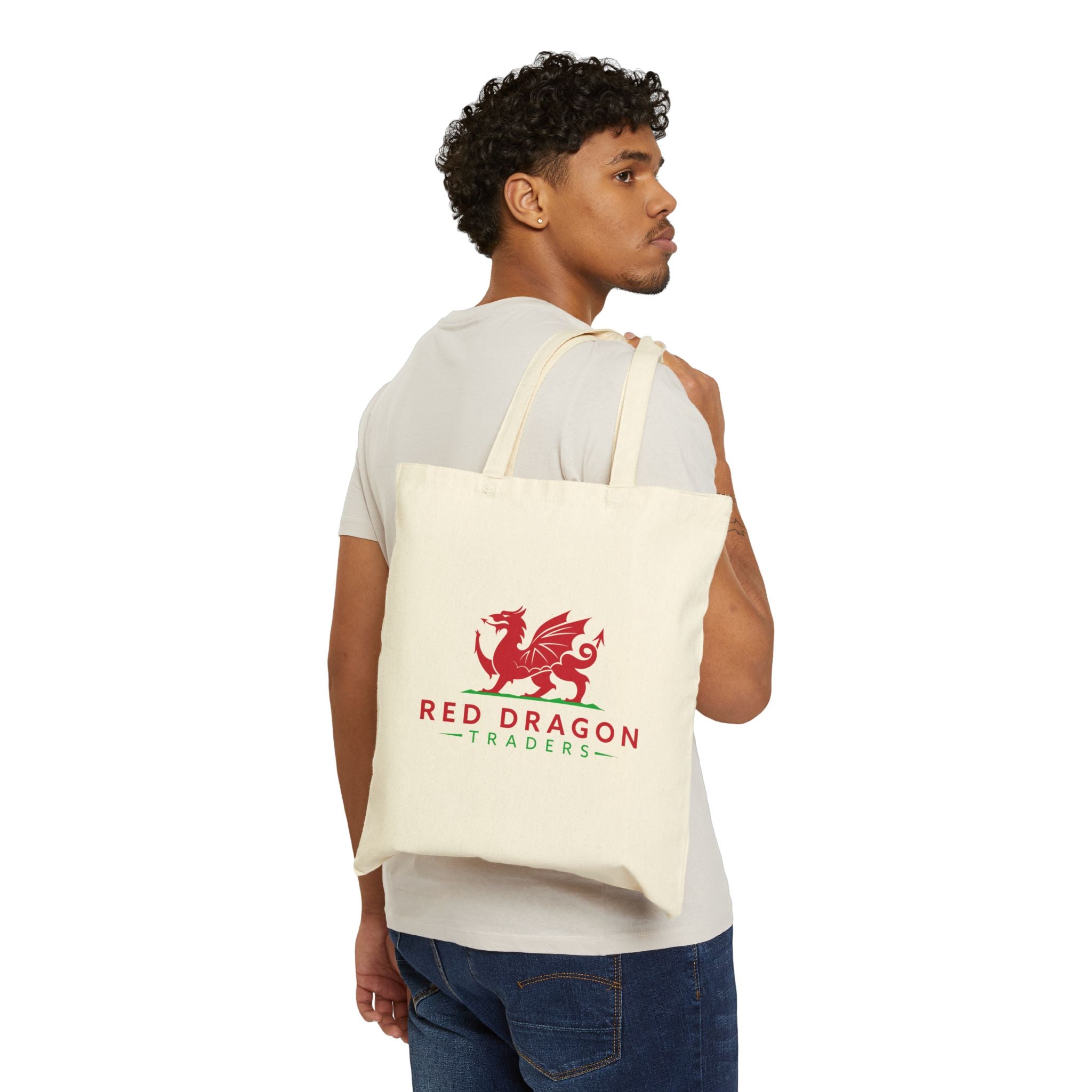 Man carrying a tote bag with 'Red Dragon Traders' logo on a white background