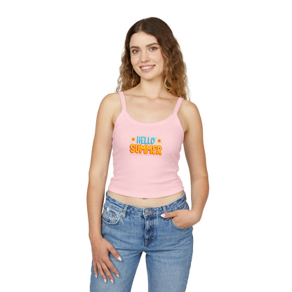 Woman wearing a pink tank top with text and blue jeans on a white background