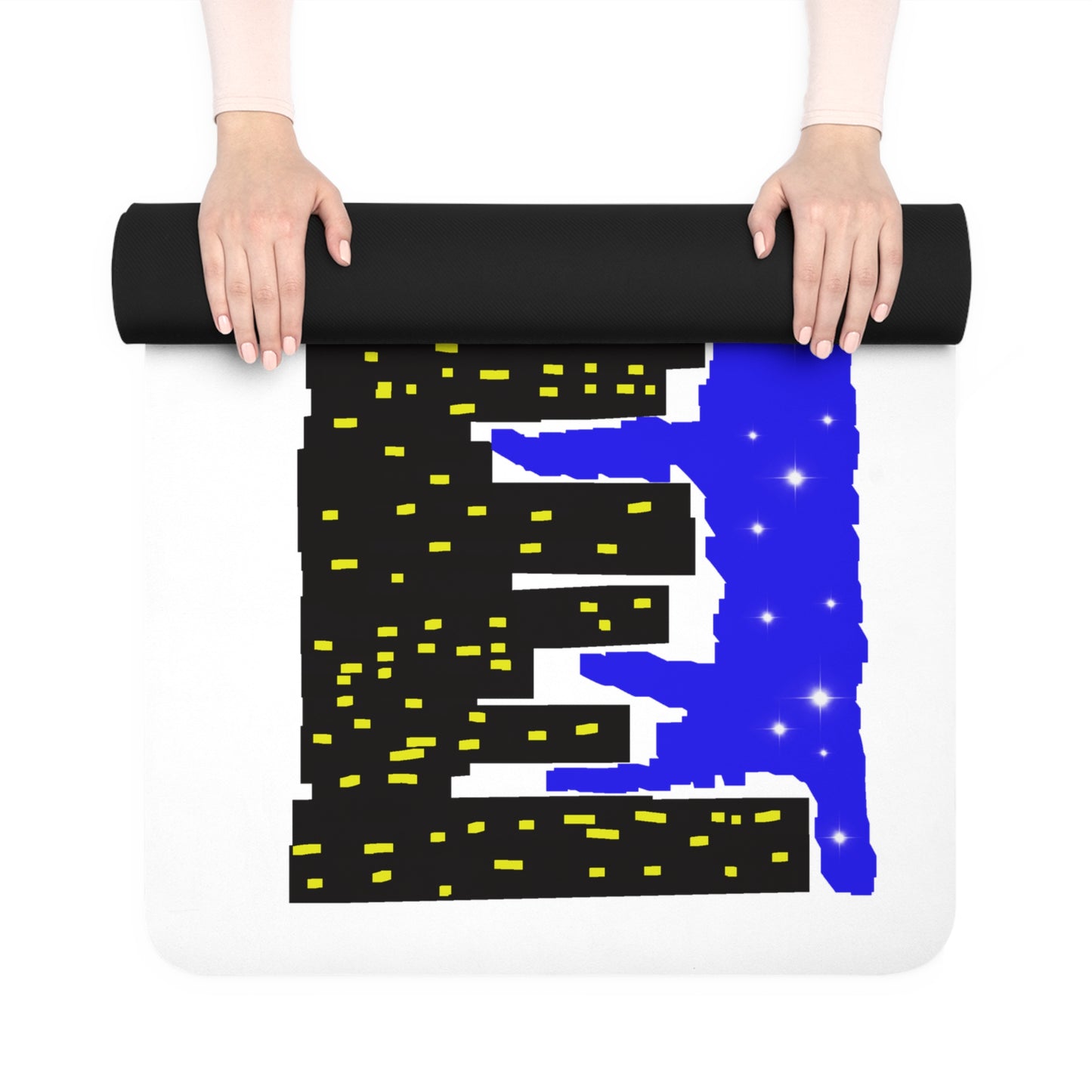 Person unrolling a black yoga mat with blue and yellow designs on a white background