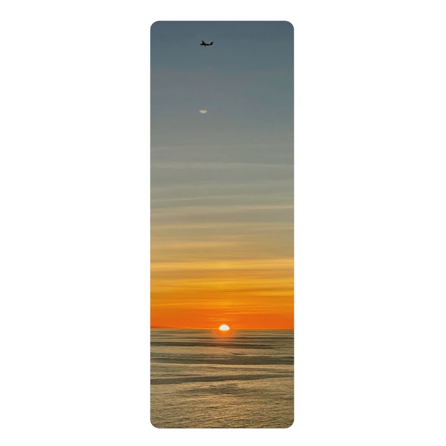 Yoga mat with a sunset design on a white background