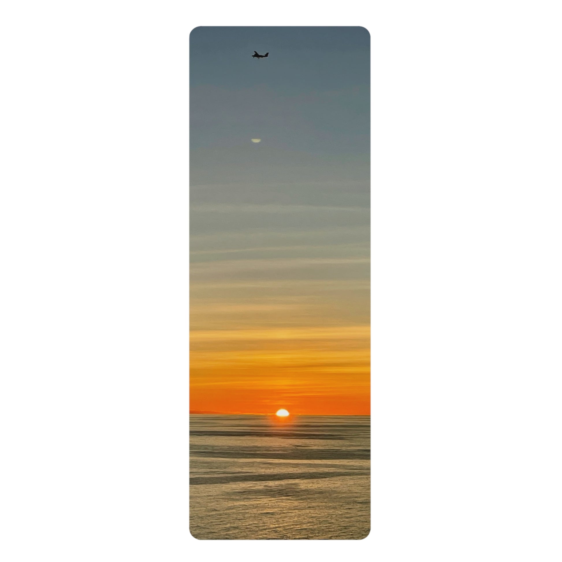 Yoga mat with a sunset design on a white background