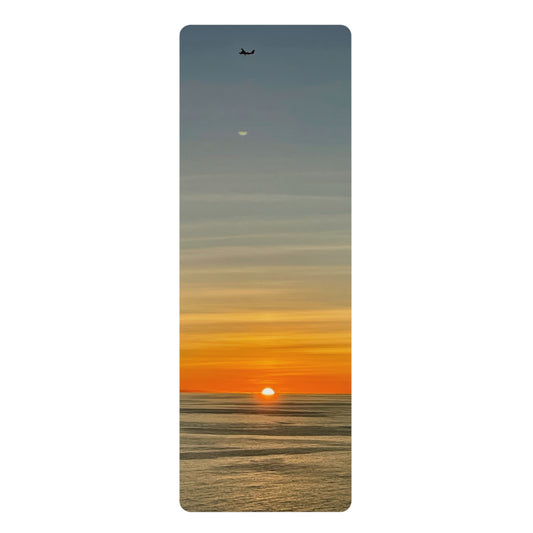 Yoga mat with a sunset design on a white background